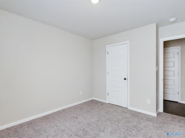 unfurnished bedroom featuring carpet flooring