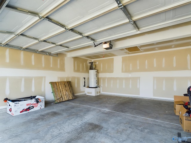 garage featuring water heater and a garage door opener