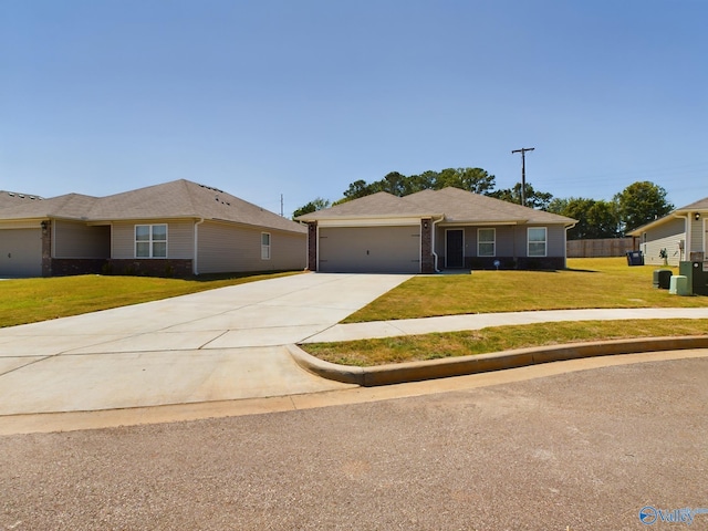 ranch-style home with a garage and a front yard