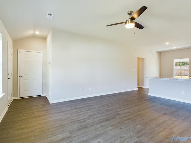 unfurnished living room featuring dark wood-type flooring, lofted ceiling, and ceiling fan