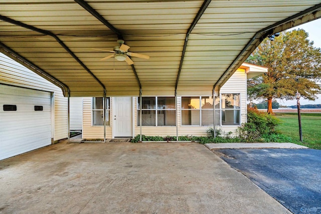 view of patio / terrace with a carport and ceiling fan