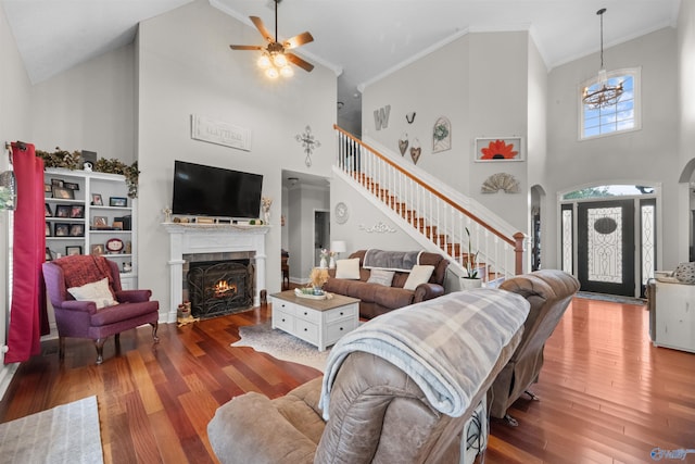 2224 Veranda Trce, Gadsden, AL 35903 - living area featuring high vaulted ceiling, arched walkways, a fireplace with flush hearth, stairway, and wood finished floors