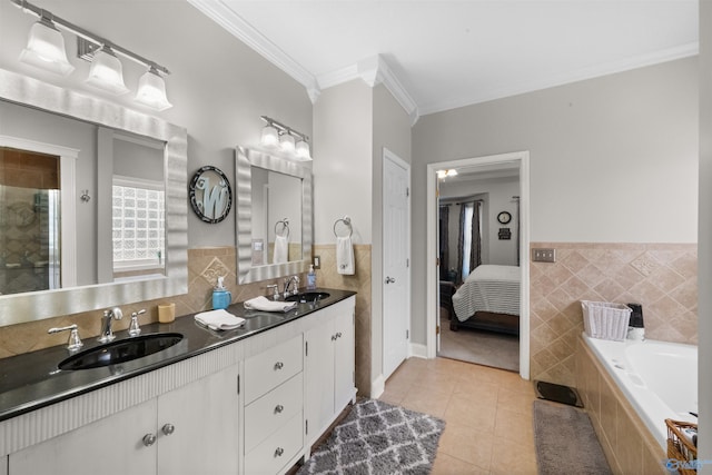2224 Veranda Trce, Gadsden, AL 35903 - ensuite bathroom featuring tile walls, crown molding, tile patterned flooring, double vanity, and tiled tub