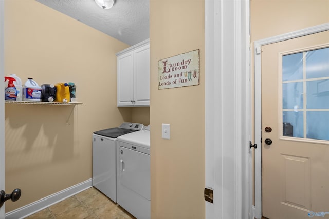 2224 Veranda Trce, Gadsden, AL 35903 - clothes washing area featuring washing machine and dryer, cabinet space, baseboards, and a textured ceiling