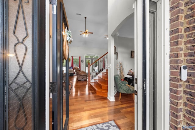 2224 Veranda Trce, Gadsden, AL 35903 - entrance foyer featuring arched walkways, ceiling fan, light wood finished floors, and stairs
