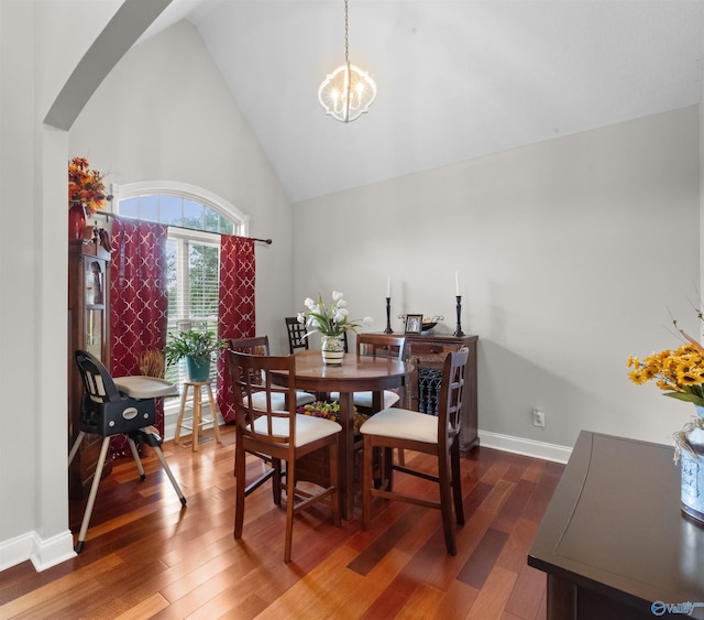 2224 Veranda Trce, Gadsden, AL 35903 - dining area featuring wood finished floors, a chandelier, high vaulted ceiling, arched walkways, and baseboards