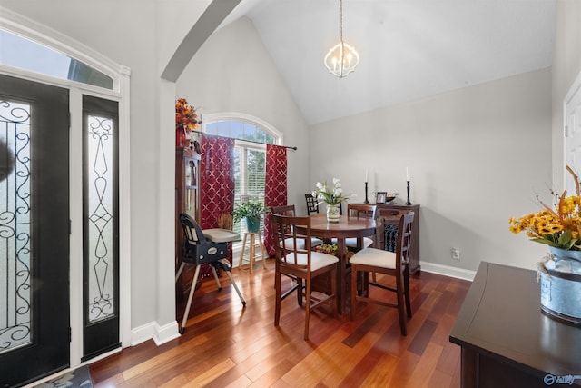 2224 Veranda Trce, Gadsden, AL 35903 - dining space featuring arched walkways, wood finished floors, high vaulted ceiling, a chandelier, and baseboards