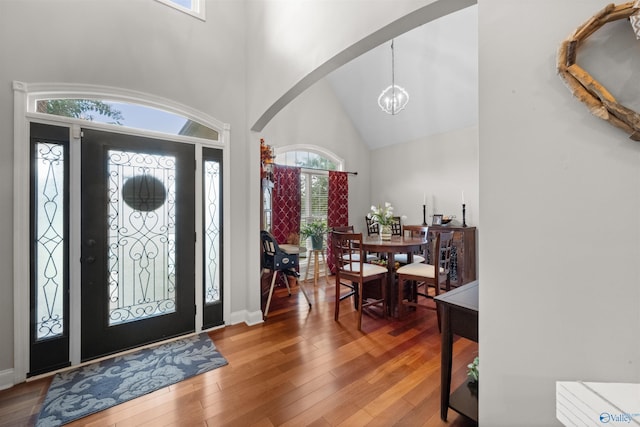 2224 Veranda Trce, Gadsden, AL 35903 - foyer featuring arched walkways, a chandelier, wood-type flooring, and a high ceiling