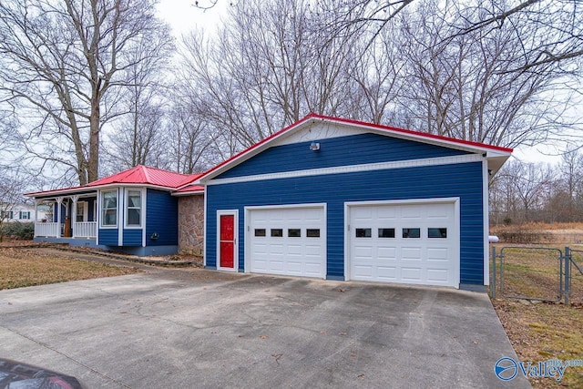 view of front facade with a garage and a porch