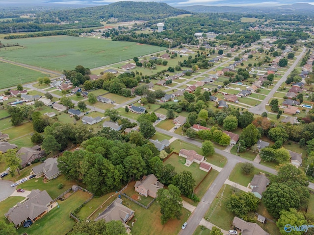 birds eye view of property with a rural view