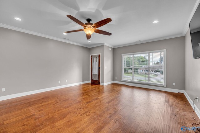 spare room featuring ornamental molding, ceiling fan, and hardwood / wood-style flooring