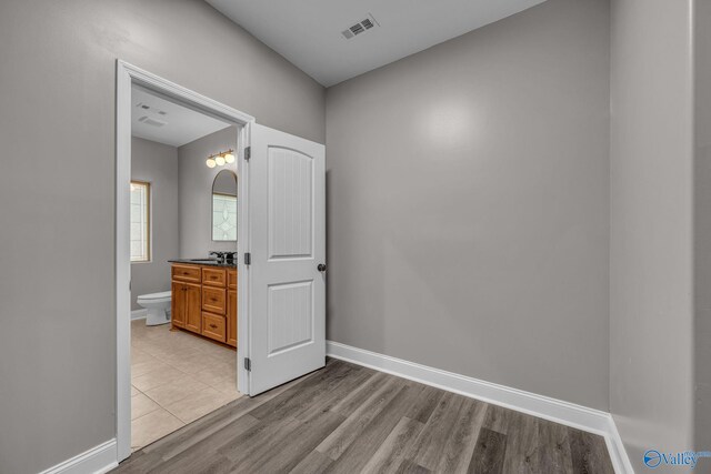 spare room with light hardwood / wood-style floors