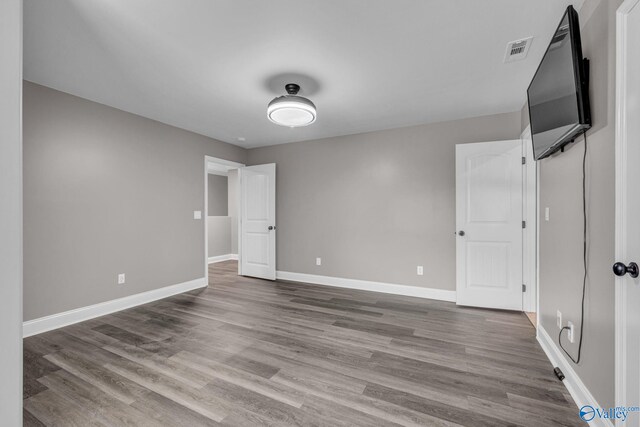 unfurnished bedroom featuring hardwood / wood-style floors