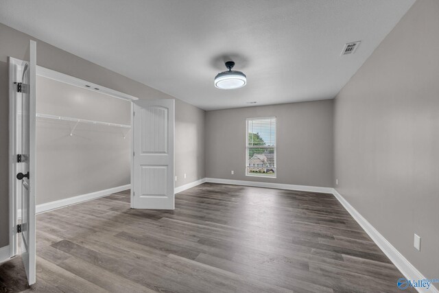 unfurnished living room featuring hardwood / wood-style floors