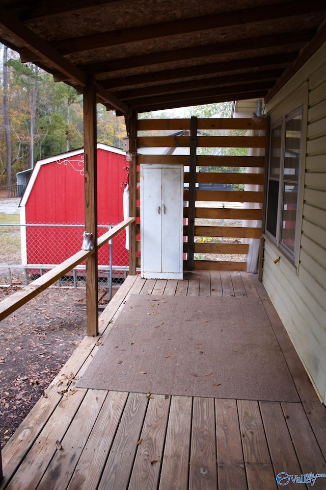 deck featuring an outdoor structure