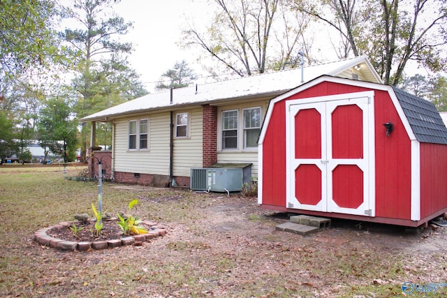 view of outdoor structure featuring central AC unit