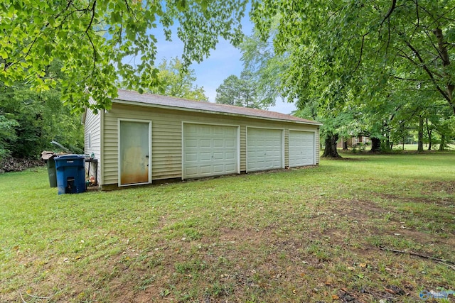 garage with a yard