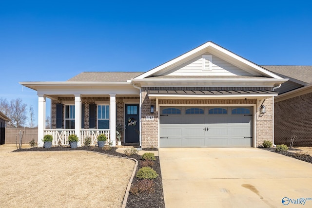 view of front of house featuring brick siding, a shingled roof, covered porch, an attached garage, and driveway