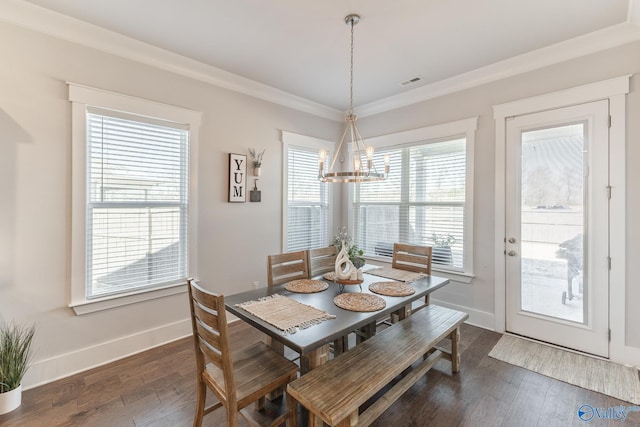 dining area featuring ornamental molding, dark wood-style flooring, visible vents, and baseboards