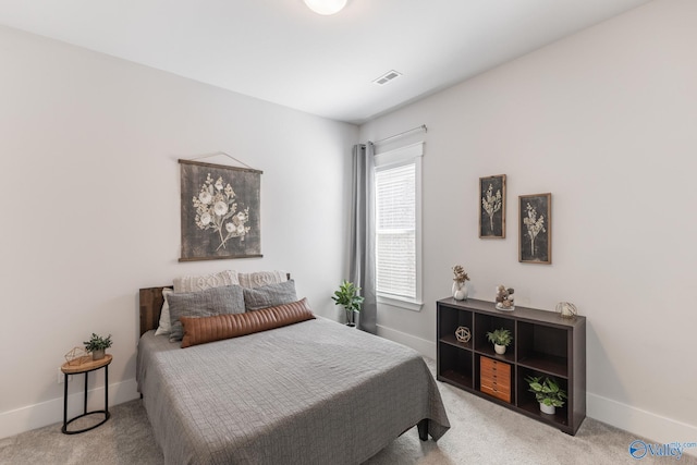 bedroom with carpet, visible vents, and baseboards