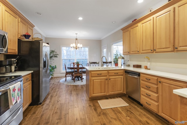 1033 Edgewood Cir, Arab, AL 35016 - kitchen with an inviting chandelier, a sink, appliances with stainless steel finishes, dark wood-style floors, and crown molding