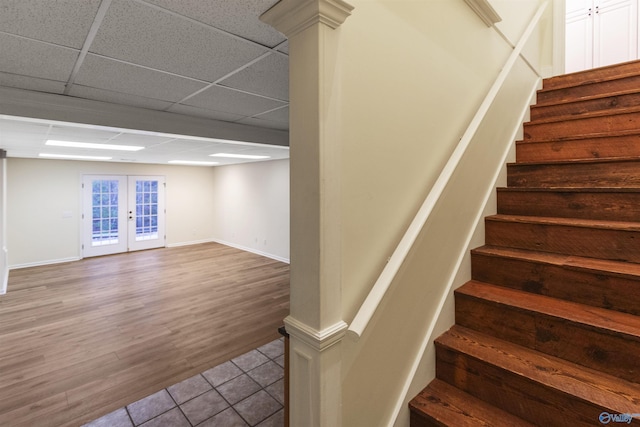 1033 Edgewood Cir, Arab, AL 35016 - stairs featuring a paneled ceiling, french doors, baseboards, and tile patterned floors