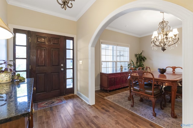 1033 Edgewood Cir, Arab, AL 35016 - foyer with arched walkways, ornamental molding, a notable chandelier, dark wood-style floors, and baseboards