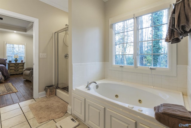 1033 Edgewood Cir, Arab, AL 35016 - ensuite bathroom featuring tile patterned flooring, crown molding, connected bathroom, a shower stall, and a tub with jets