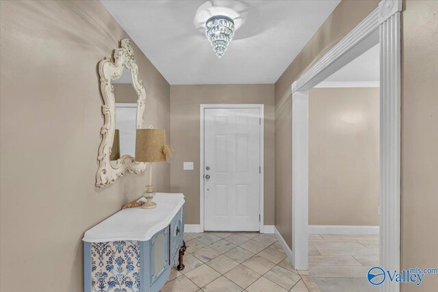 bedroom featuring ornamental molding, a notable chandelier, and light wood-type flooring