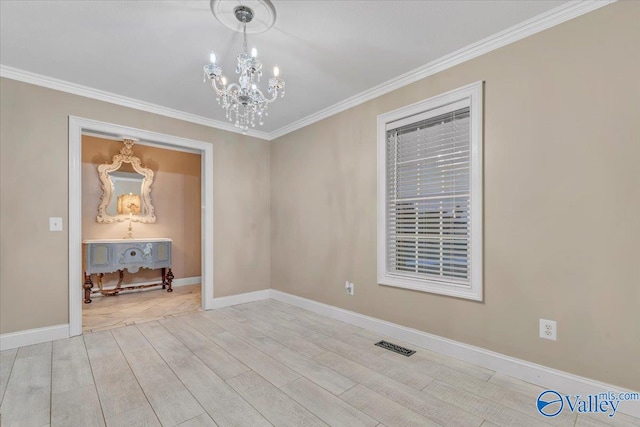 unfurnished room featuring ornamental molding, a notable chandelier, and light hardwood / wood-style flooring