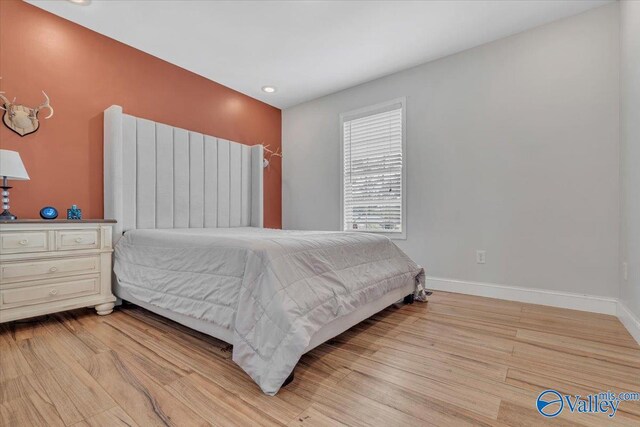 bedroom with light hardwood / wood-style floors