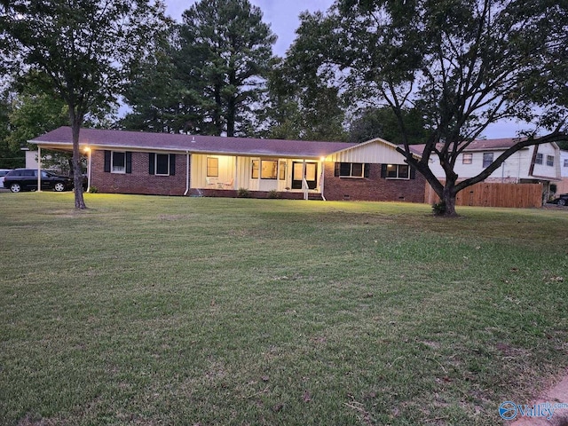 ranch-style house with a lawn