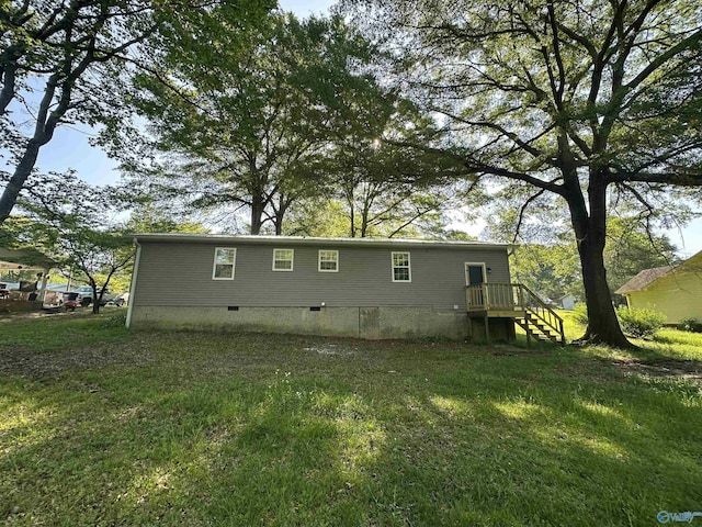 rear view of house featuring crawl space