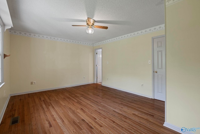 114 Butch Cir, Hazel Green, AL 35750 - unfurnished room with a ceiling fan, wood finished floors, and a textured ceiling