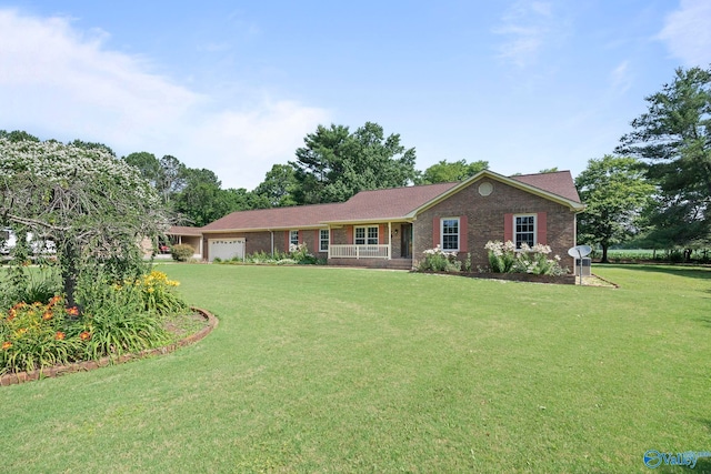 114 Butch Cir, Hazel Green, AL 35750 - single story home featuring an attached garage, a front yard, and brick siding