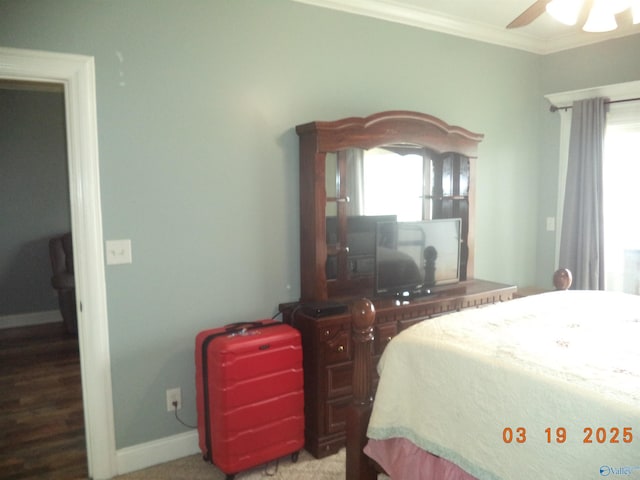 bedroom featuring a ceiling fan, baseboards, and ornamental molding