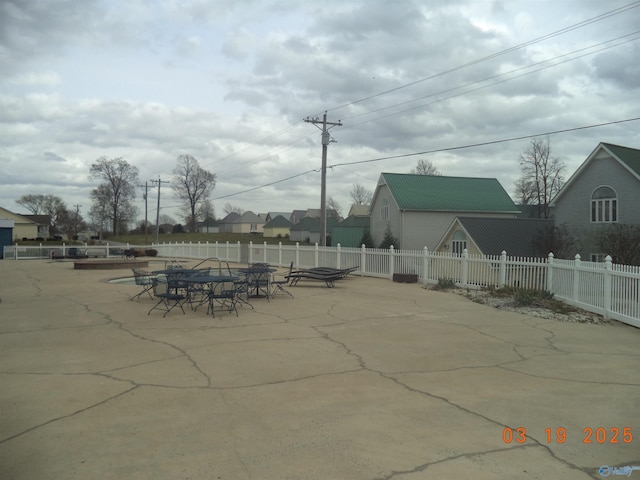 view of patio featuring fence