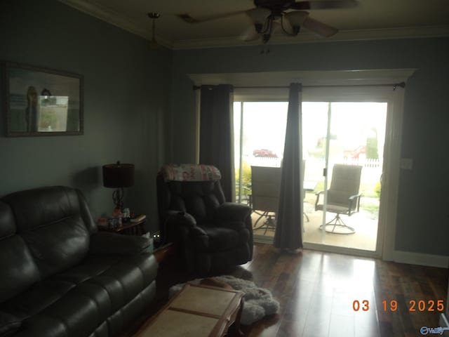 living area featuring baseboards, wood finished floors, ceiling fan, and ornamental molding