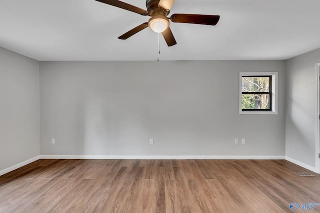 spare room with ceiling fan and light hardwood / wood-style floors