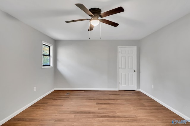 unfurnished room featuring ceiling fan and light wood-type flooring