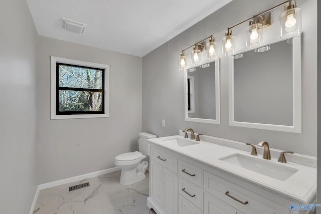 bathroom with vanity and toilet