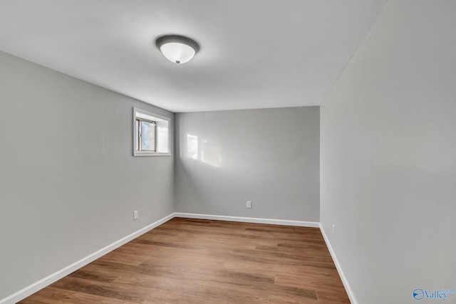 unfurnished room featuring hardwood / wood-style floors