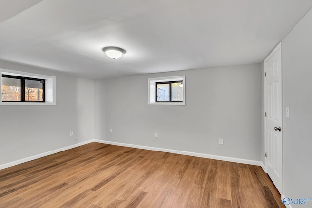 spare room with light hardwood / wood-style floors