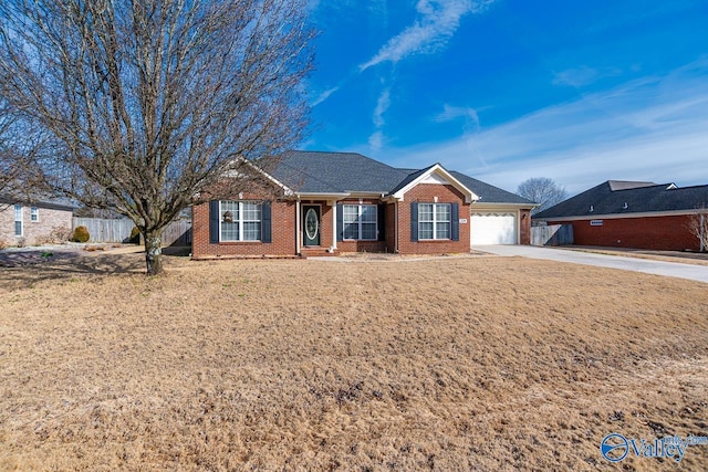 ranch-style house with a garage, brick siding, fence, concrete driveway, and a front lawn