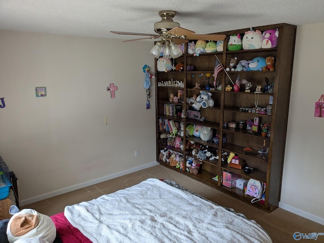 bedroom featuring carpet flooring, a textured ceiling, and baseboards