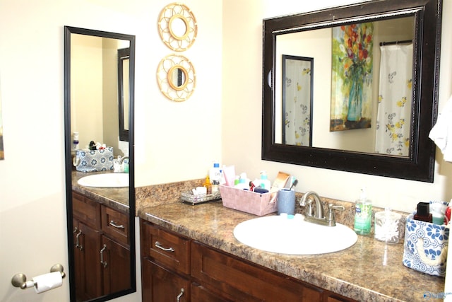 full bathroom featuring vanity