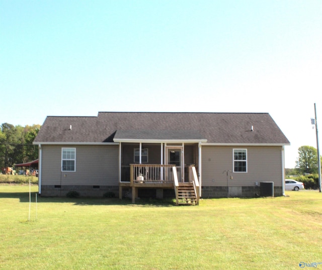 rear view of house featuring a lawn, crawl space, a wooden deck, and central AC unit