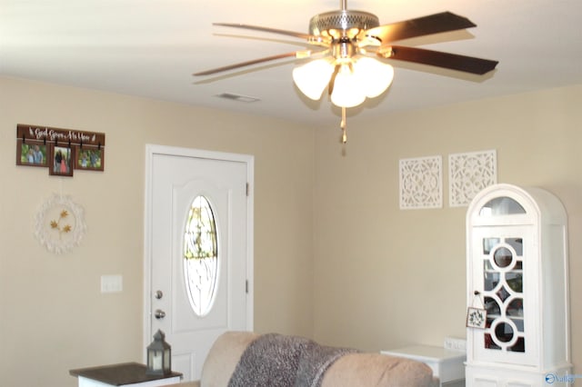 entryway with visible vents and ceiling fan