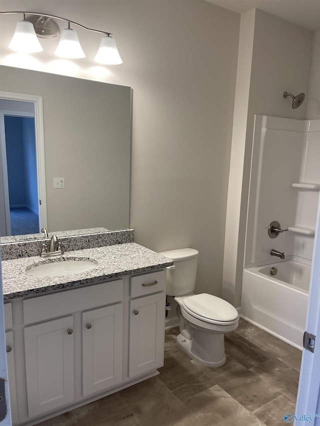 full bathroom featuring vanity, shower / bathing tub combination, and toilet