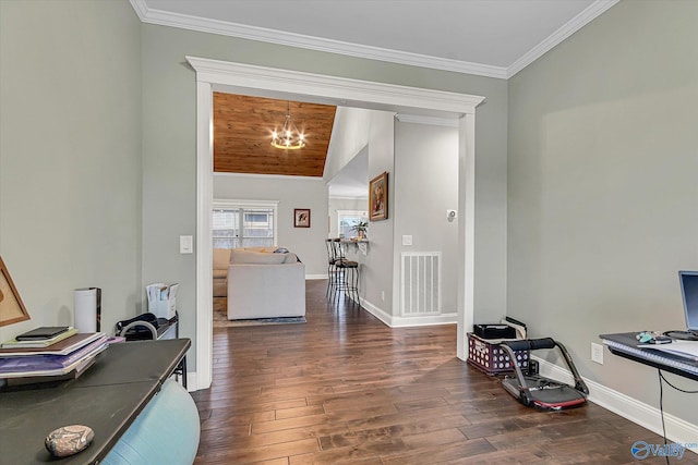 office space with baseboards, visible vents, dark wood finished floors, ornamental molding, and a chandelier